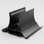 Gros plan sur l'intérieur des mâchoires du support vertical ErgoStudio, montrant les pads en silicone antidérapants pour protéger l'ordinateur des rayures.